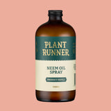 Bottle of Plant Runner Neem Oil Spray on a pink background