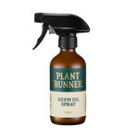 Glass spray bottle labeled 'Plant Runner Neem Oil Spray' 