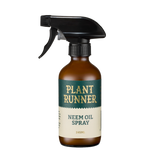 Glass spray bottle labeled 'Plant Runner Neem Oil Spray' 
